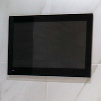 T.V visible from both the bath and shower image